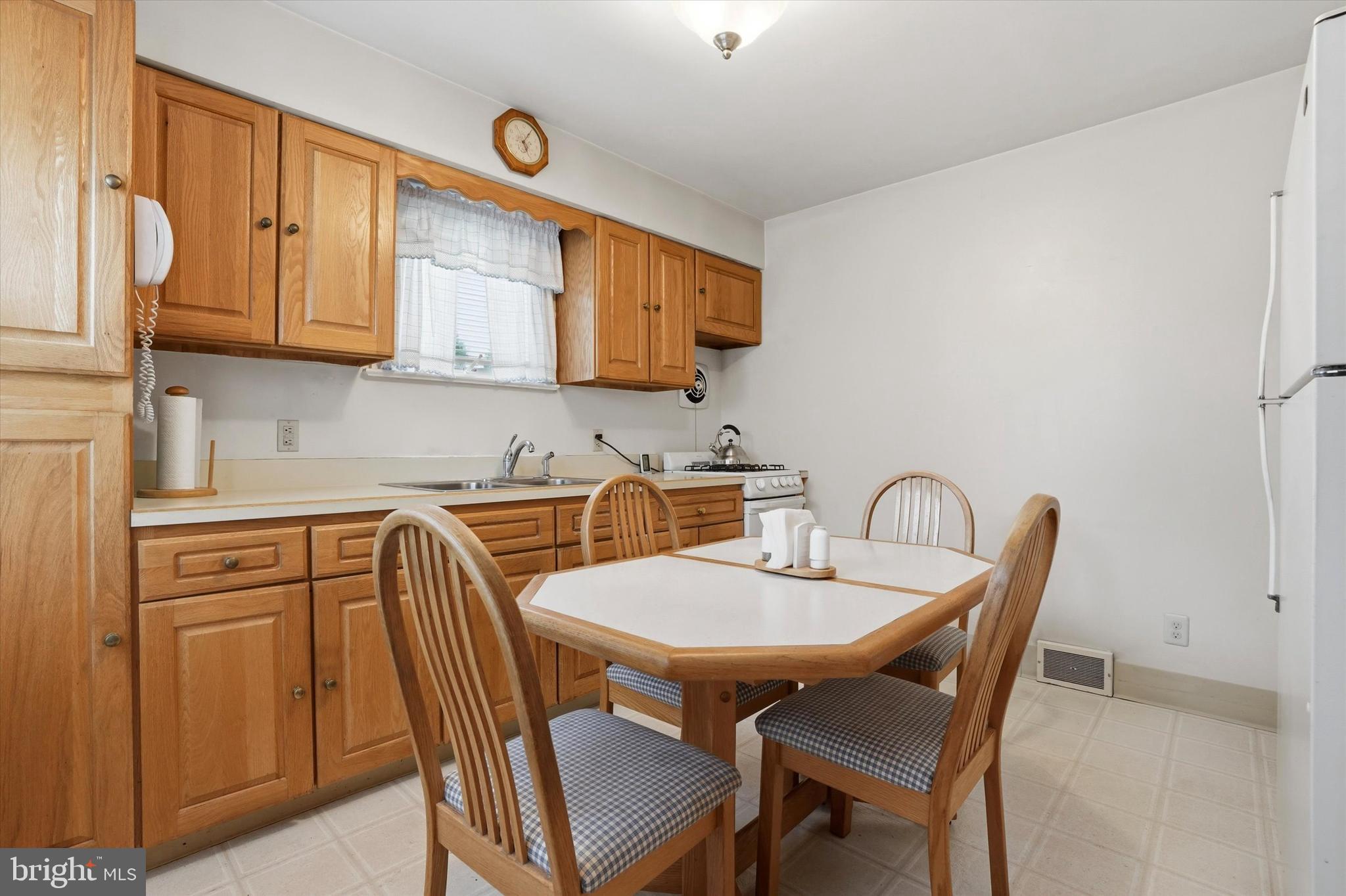 100 Wagner Street Hamilton, NJ 08610 - Photo 11 of 15 a kitchen with stainless steel appliances granite countertop a table and chairs
