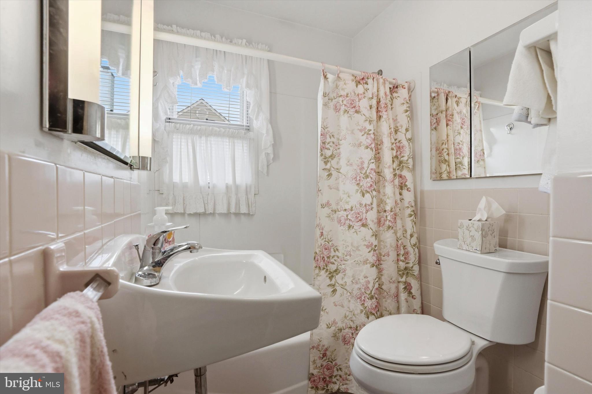 100 Wagner Street Hamilton, NJ 08610 - Photo 6 of 15 a white toilet sitting next to a bathroom sink