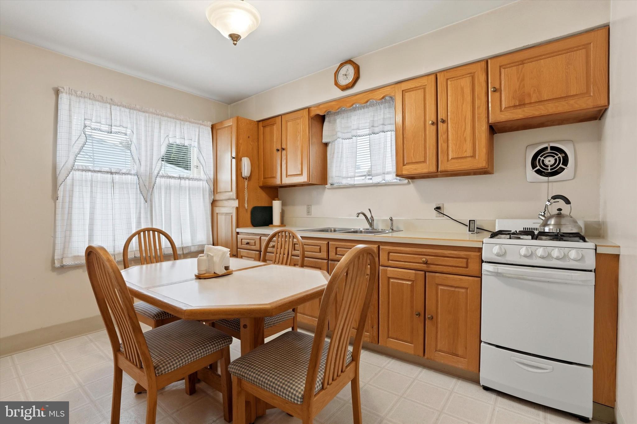 100 Wagner Street Hamilton, NJ 08610 - Photo 10 of 15 a kitchen with a stove a sink and a refrigerator