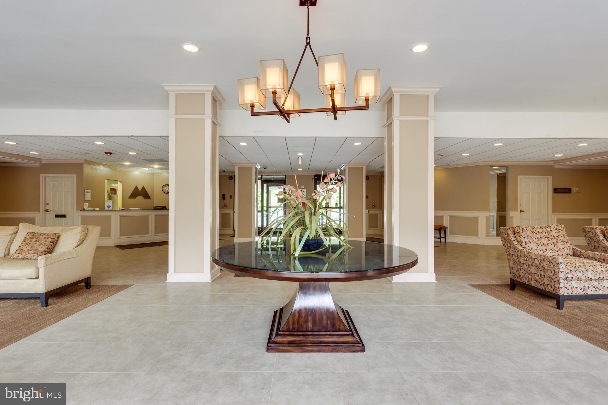 6800 Fleetwood Road, Unit 810 McLean, VA 22101 - Photo 24 of 30 a lobby with furniture and a chandelier