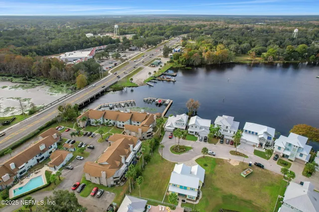 an aerial view of residential houses with outdoor space