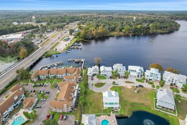 an aerial view of a house with a lake view
