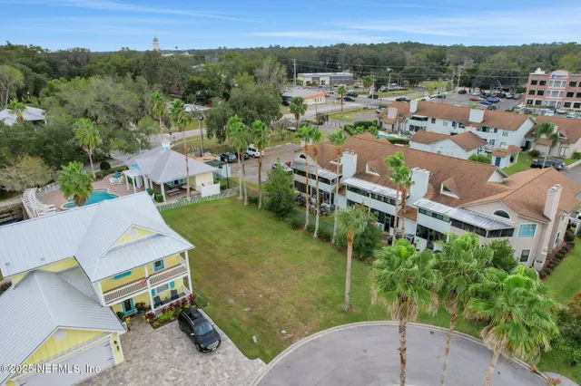 an aerial view of a house with a swimming pool