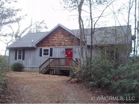 419 Whippoorwhil Ln Mill Spring Mill Spring, NC 28756 - Photo 1 of 1 a front view of a house with a yard and garage