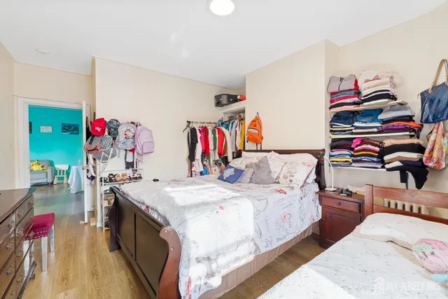 a bed room with a bed and a white couch