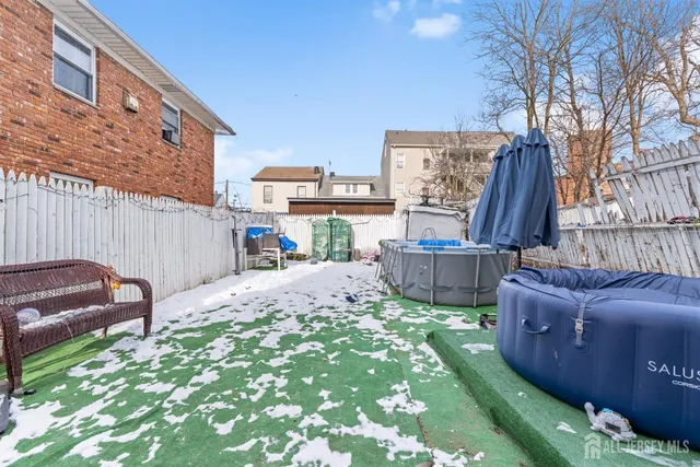 a view of a backyard with furniture