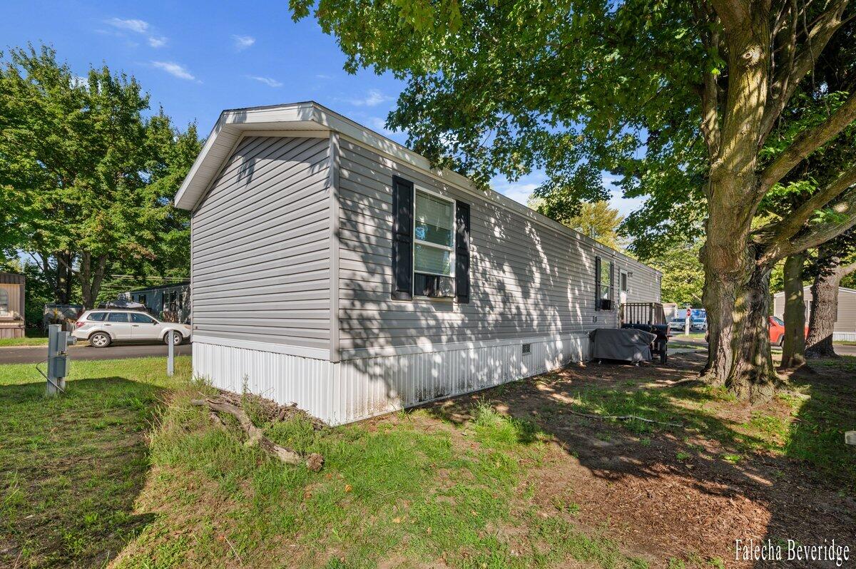 1281 East Pontaluna Road, Unit 101 Spring Lake, MI 49456 - Photo 2 of 18 EXTERIOR