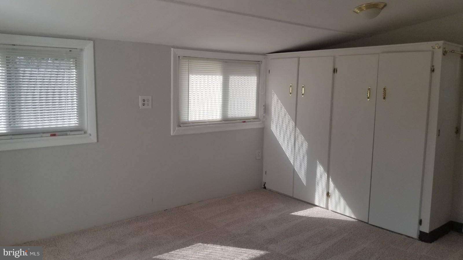 7828 Burnside Road Landover, MD 20785 - Photo 4 of 12 a view of an empty room with a window