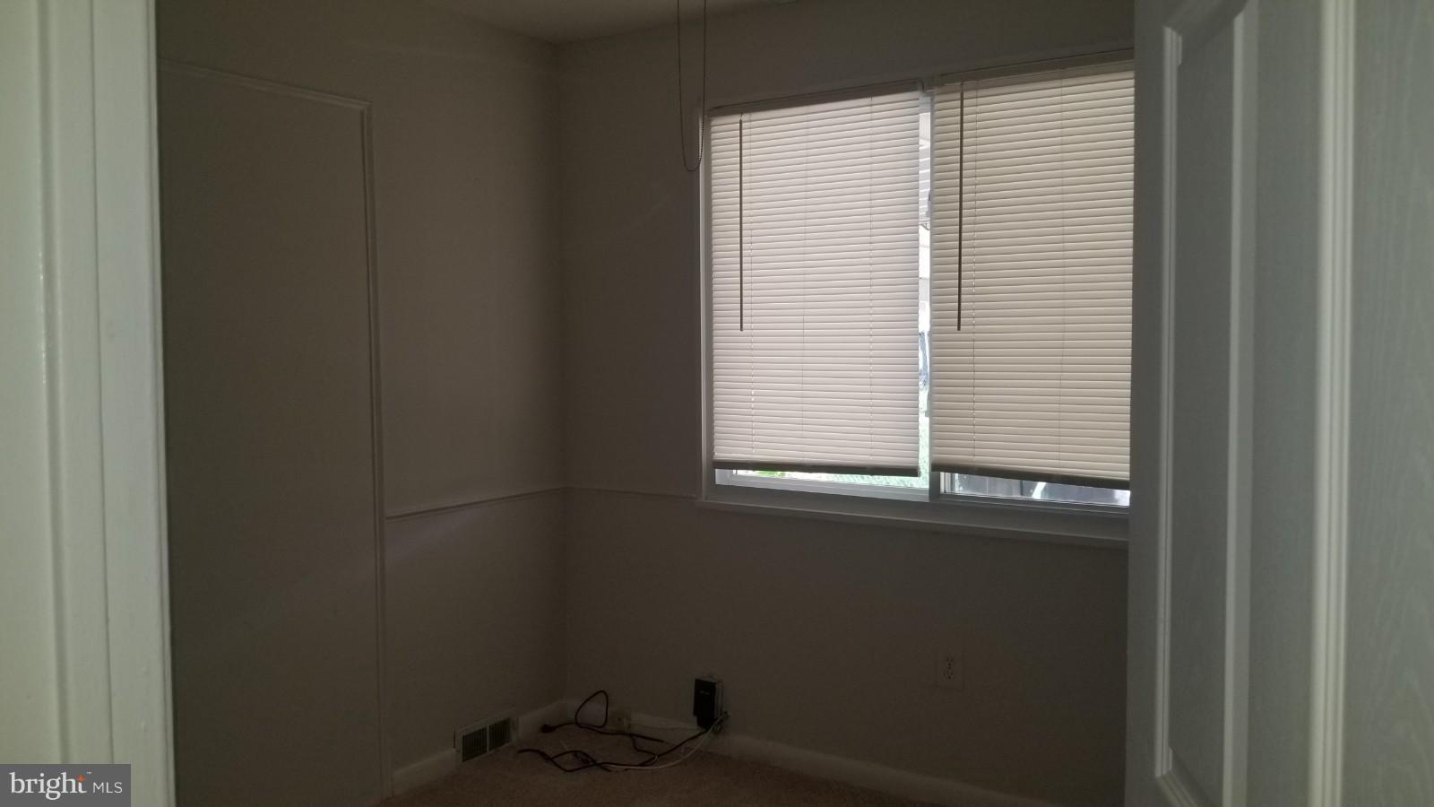 7828 Burnside Road Landover, MD 20785 - Photo 9 of 12 a bathroom with a window