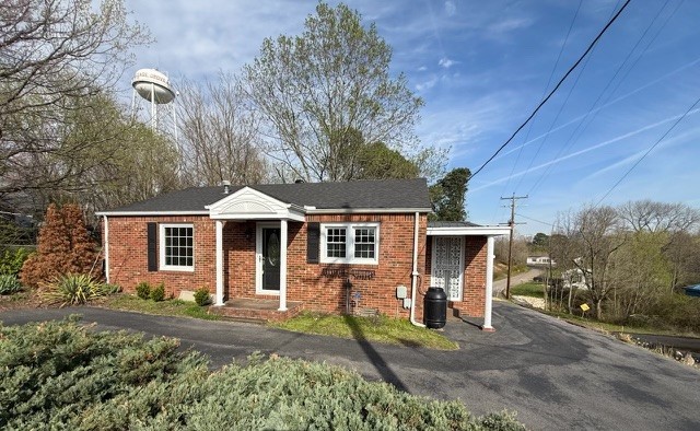 10 Locust Street Cottage Grove, TN 38224 - Photo 12 of 16 front view of a house with a yard