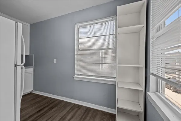 a view of walk in closet with empty racks