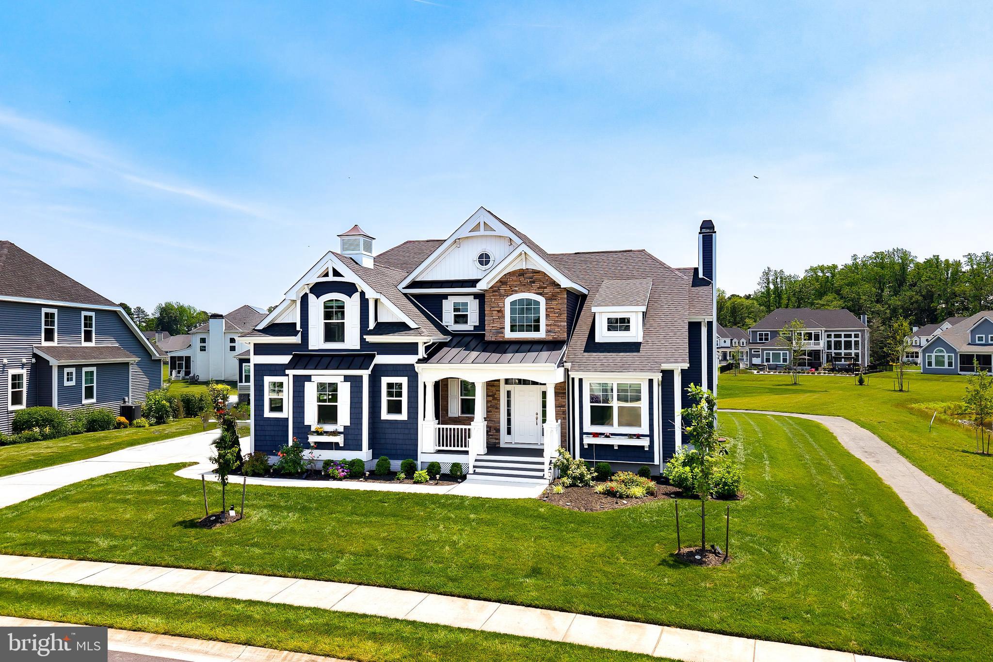 33557 Downing Circle Lewes, DE 19958 - Photo 1 of 89 front view of a house with a yard