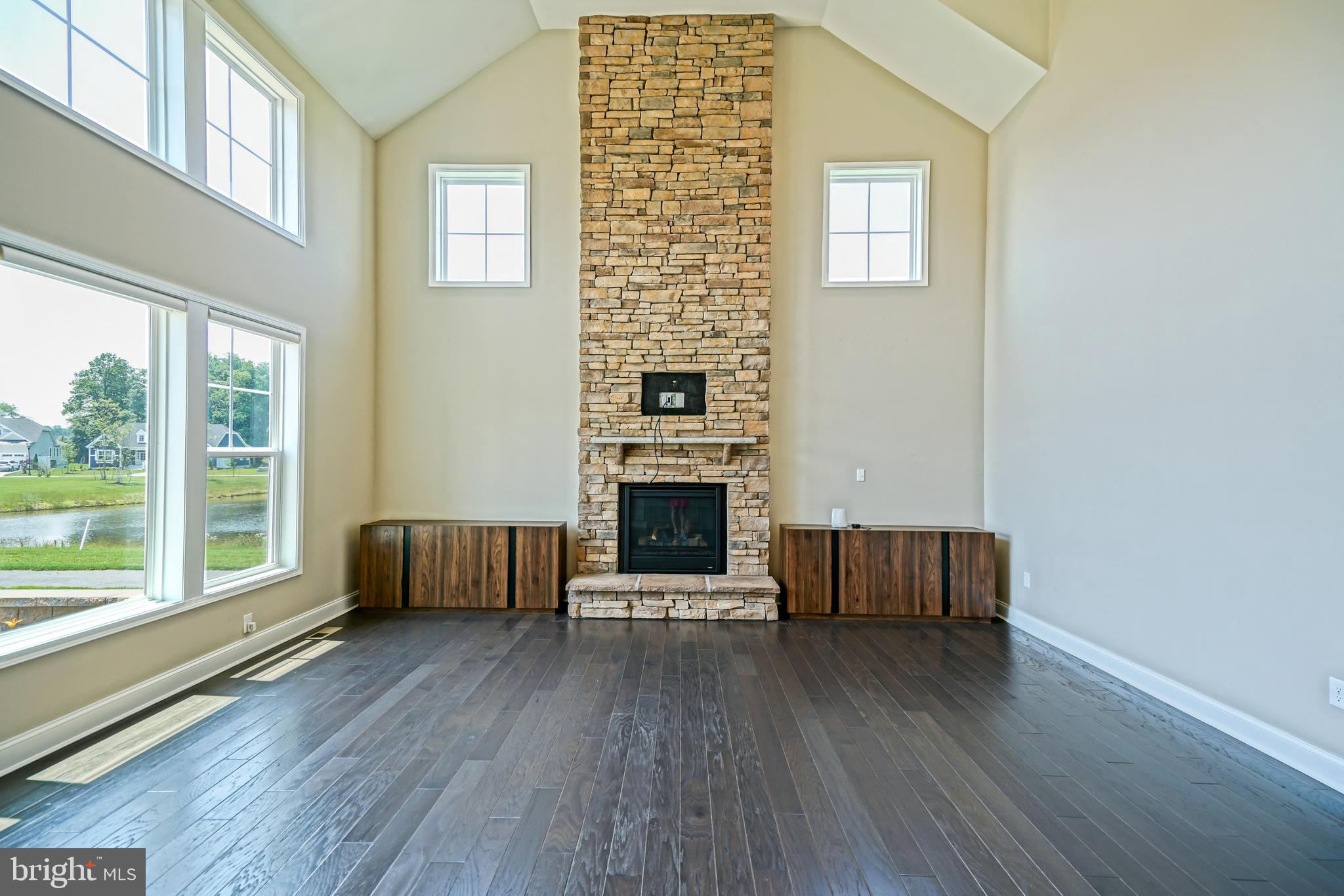 33557 Downing Circle Lewes, DE 19958 - Photo 13 of 89 a living room with furniture and a fireplace