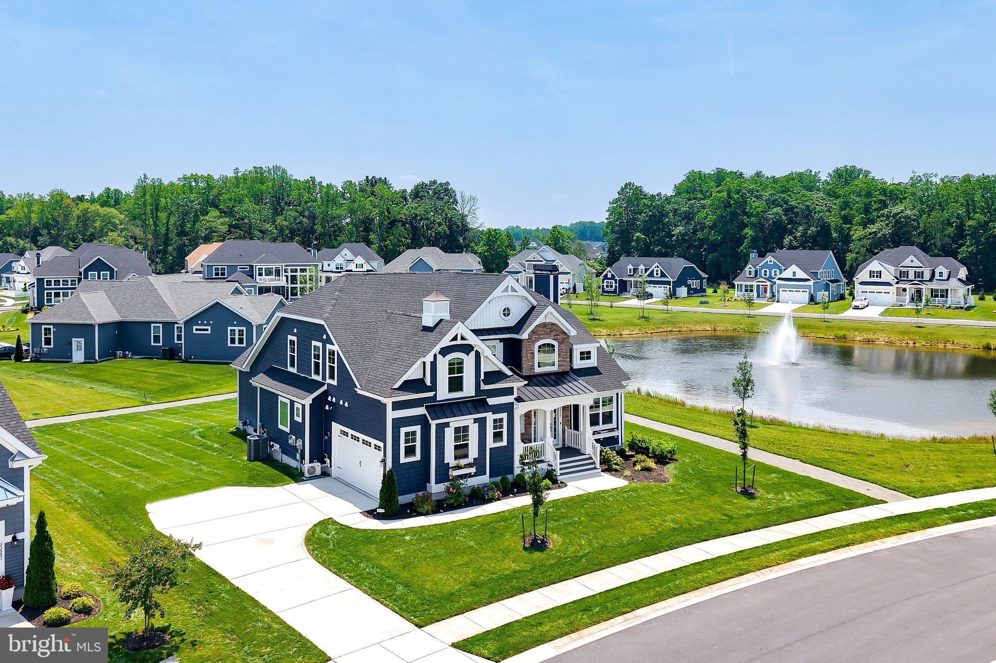 33557 Downing Circle Lewes, DE 19958 - Photo 2 of 89 an aerial view of a house with swimming pool and big yard