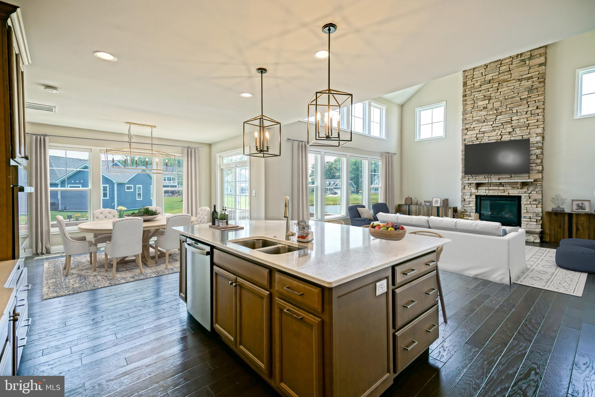 33557 Downing Circle Lewes, DE 19958 - Photo 25 of 89 a view of living room with kitchen island furniture and wooden floor