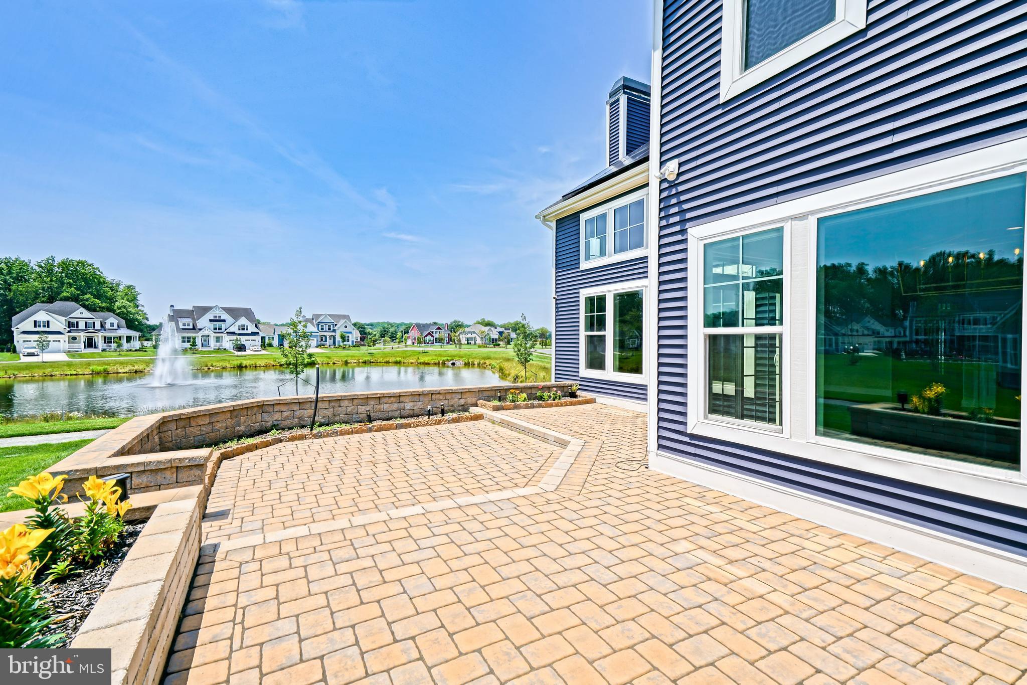 33557 Downing Circle Lewes, DE 19958 - Photo 71 of 89 a view of a house with a yard and sitting area