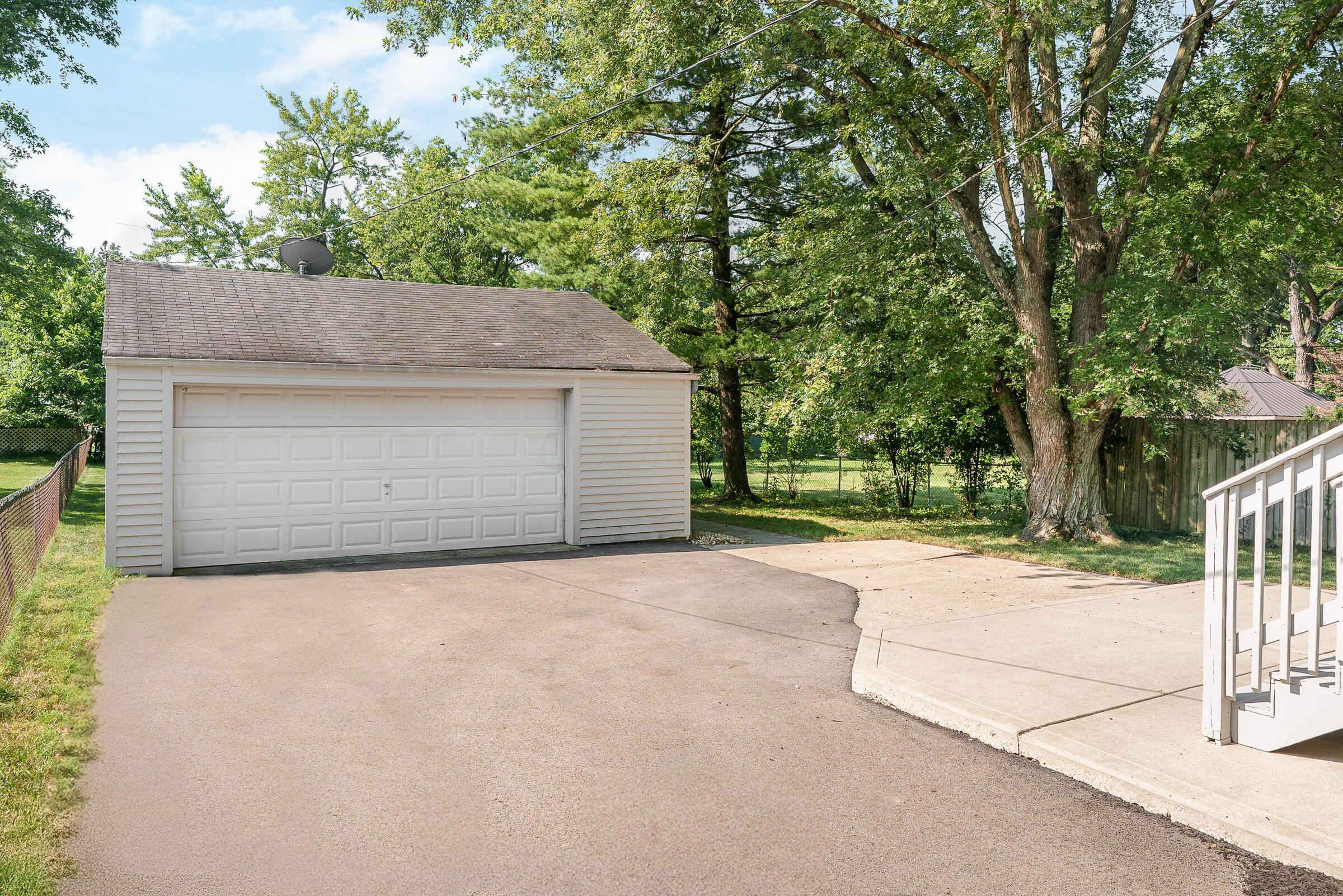 163 Garden Road Columbus, OH 43214 - Photo 2 of 46 Enjoy a new driveway ('23) and 2+ car garage with openers offering ample space to park & store your stuff!