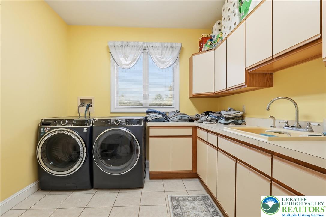 5217 Cider Press Road Schnecksville, PA 18078 - Photo 24 of 54 a utility room with sink dryer and washer