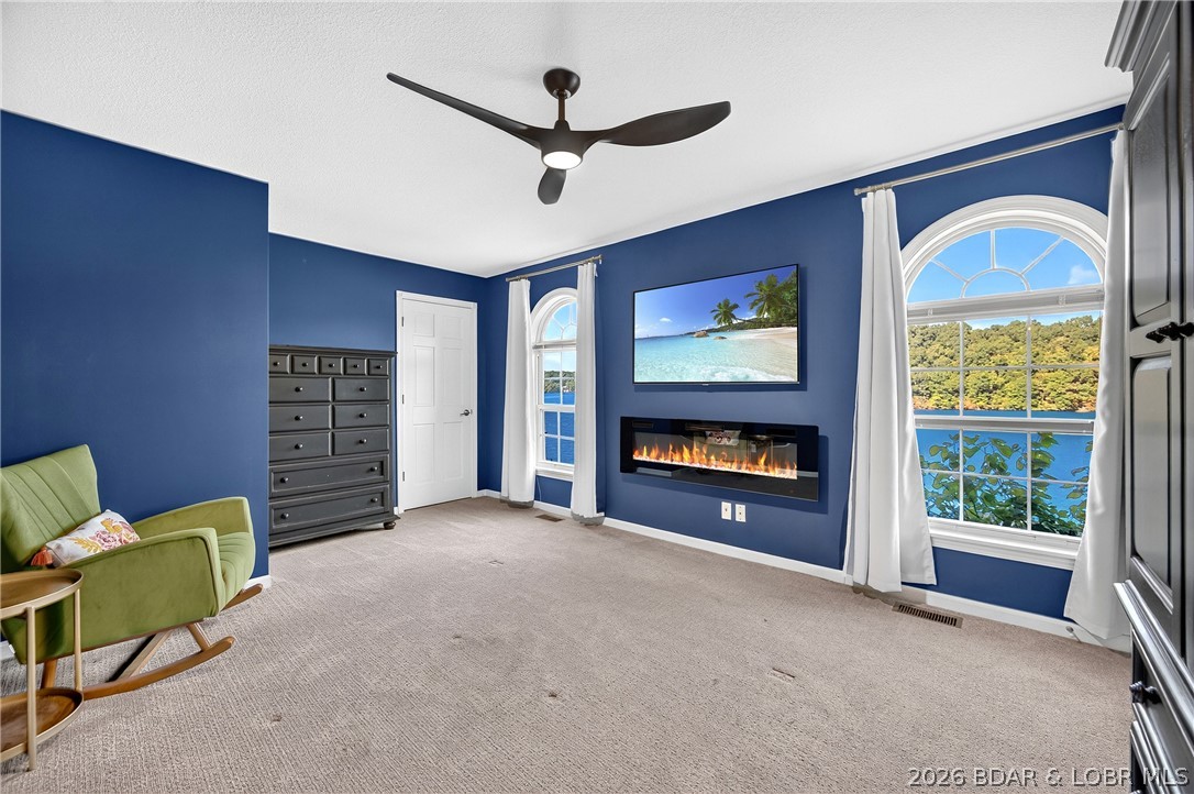 26427 Lake Front Road Rocky Mount, MO 65072 - Photo 40 of 69 Modern fireplace & picturesque lakeview