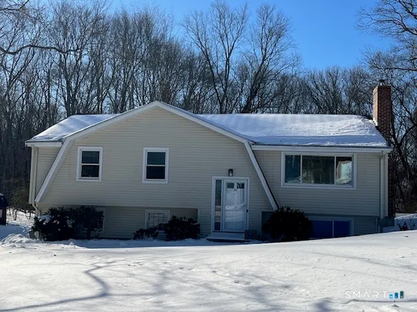 a house with trees in the background