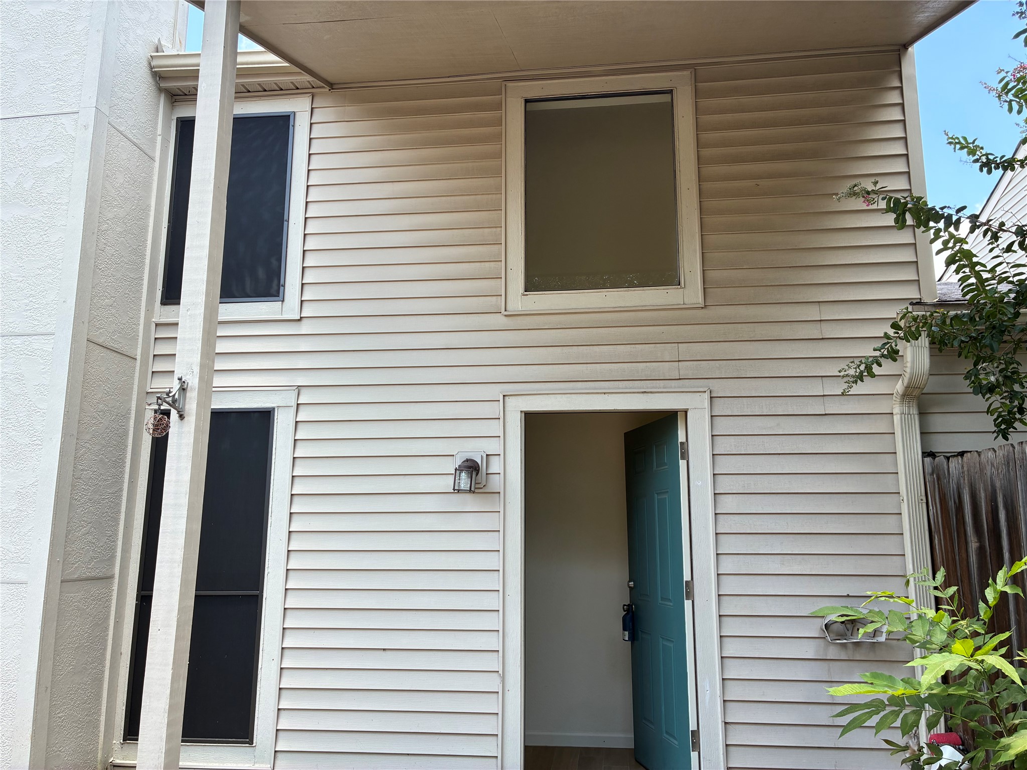 6401 Deihl Road, Unit 1011 Houston, TX 77092 - Photo 3 of 16 a view of a house with a door and a tree