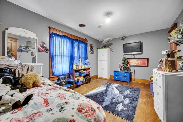 a bedroom with furniture and a window