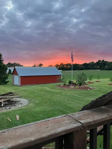 a view of a backyard with plants and a patio