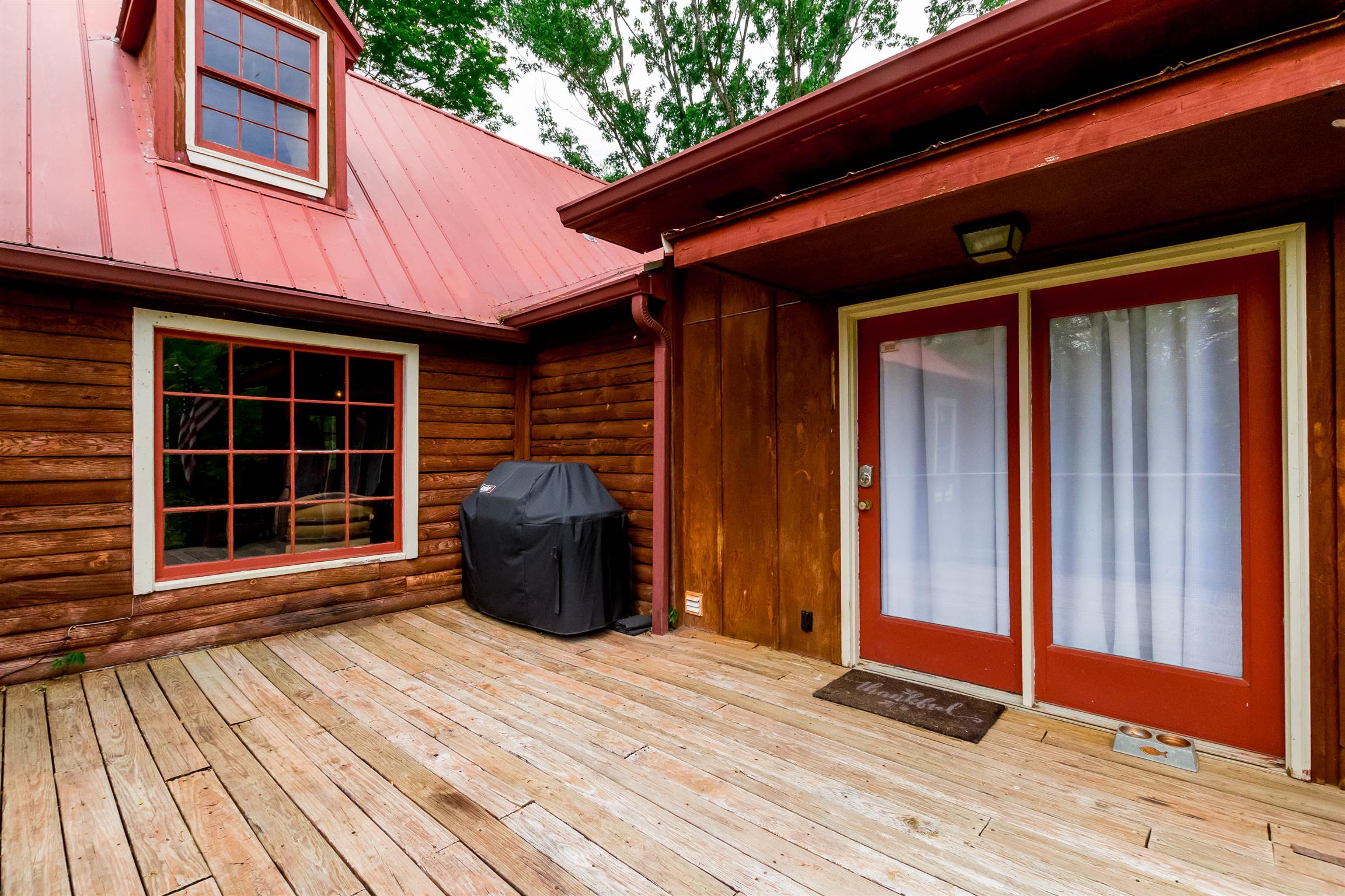 9723 Concord Road Brentwood, TN 37027 - Photo 12 of 30 a view of a backyard of a house with wooden floor and iron fence