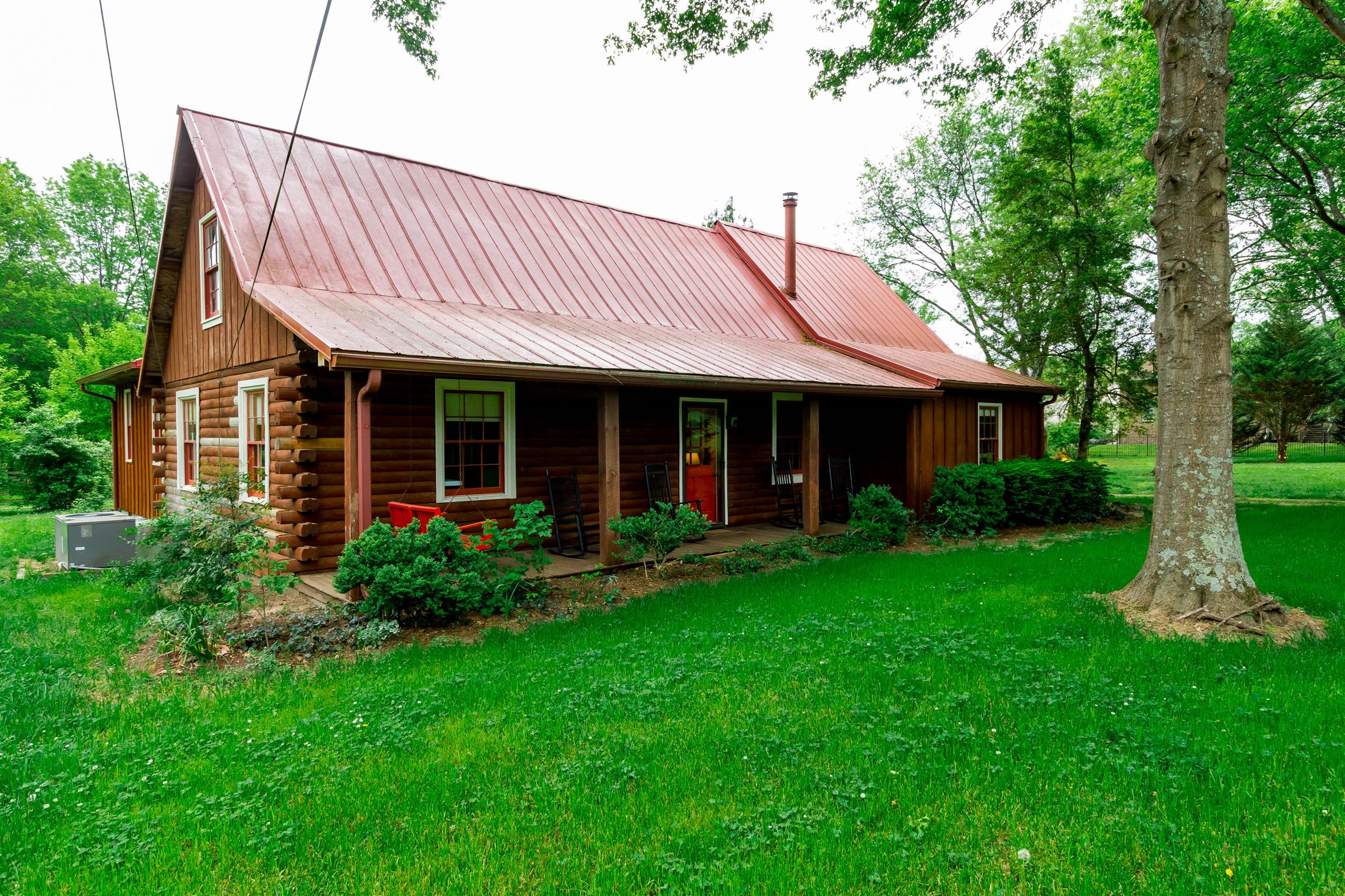 9723 Concord Road Brentwood, TN 37027 - Photo 4 of 30 a view of a house with garden and yard