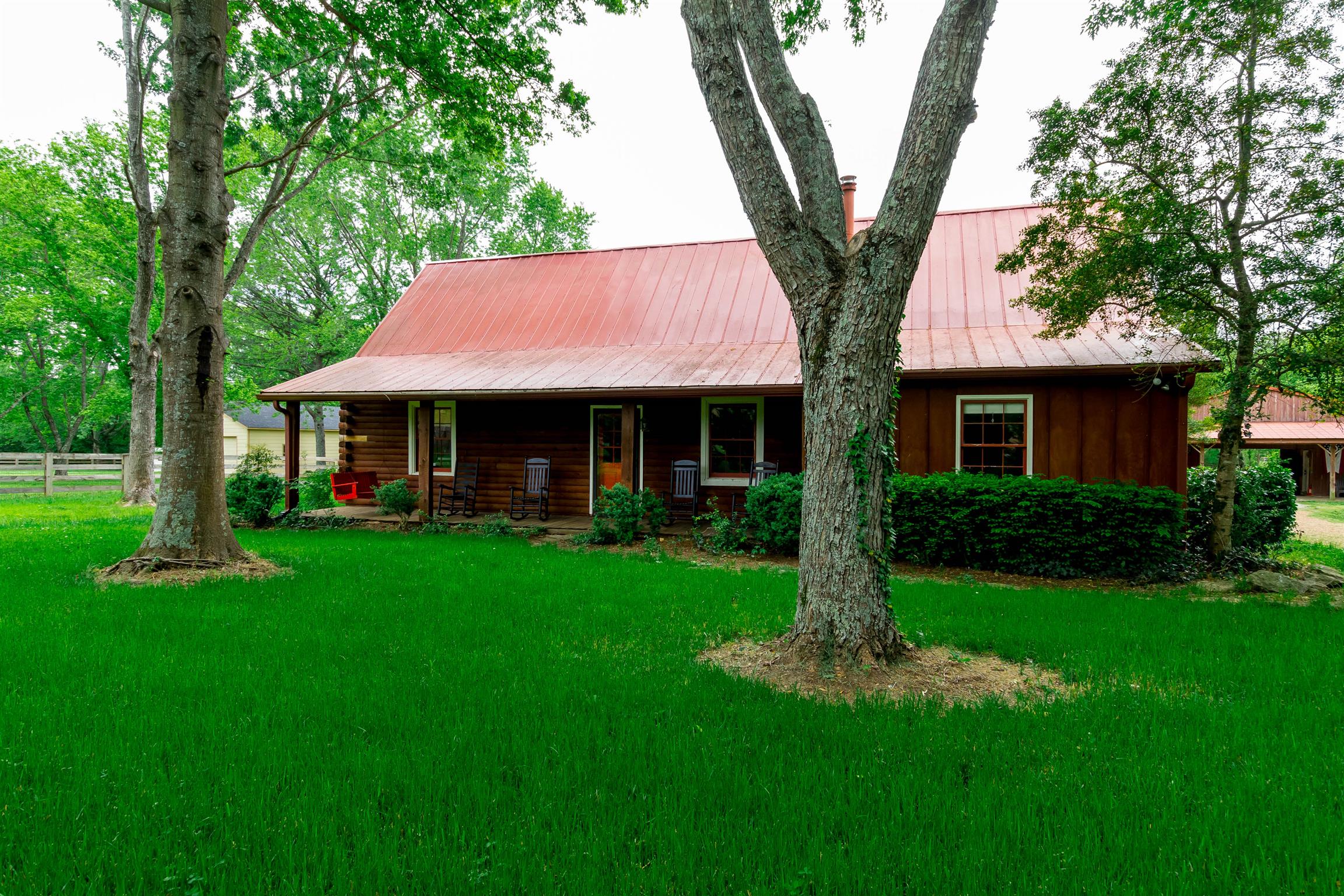9723 Concord Road Brentwood, TN 37027 - Photo 6 of 30 a front view of a house with garden