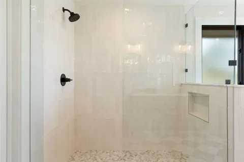 a bathroom with a double vanity sink and mirror