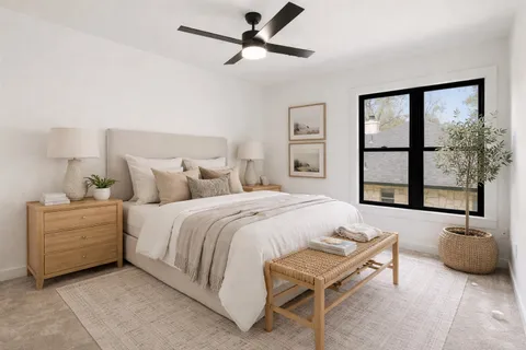 a bedroom with a bed and a dresser