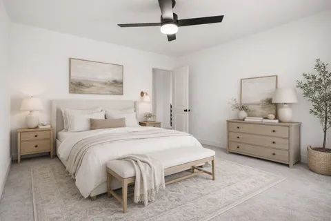 a spacious bedroom with a bed and a couch