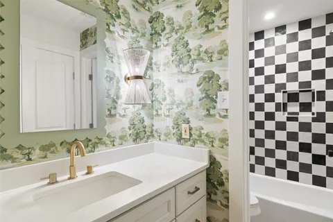 a bathroom with a sink and a mirror