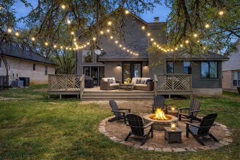 a view of a yard with swimming pool