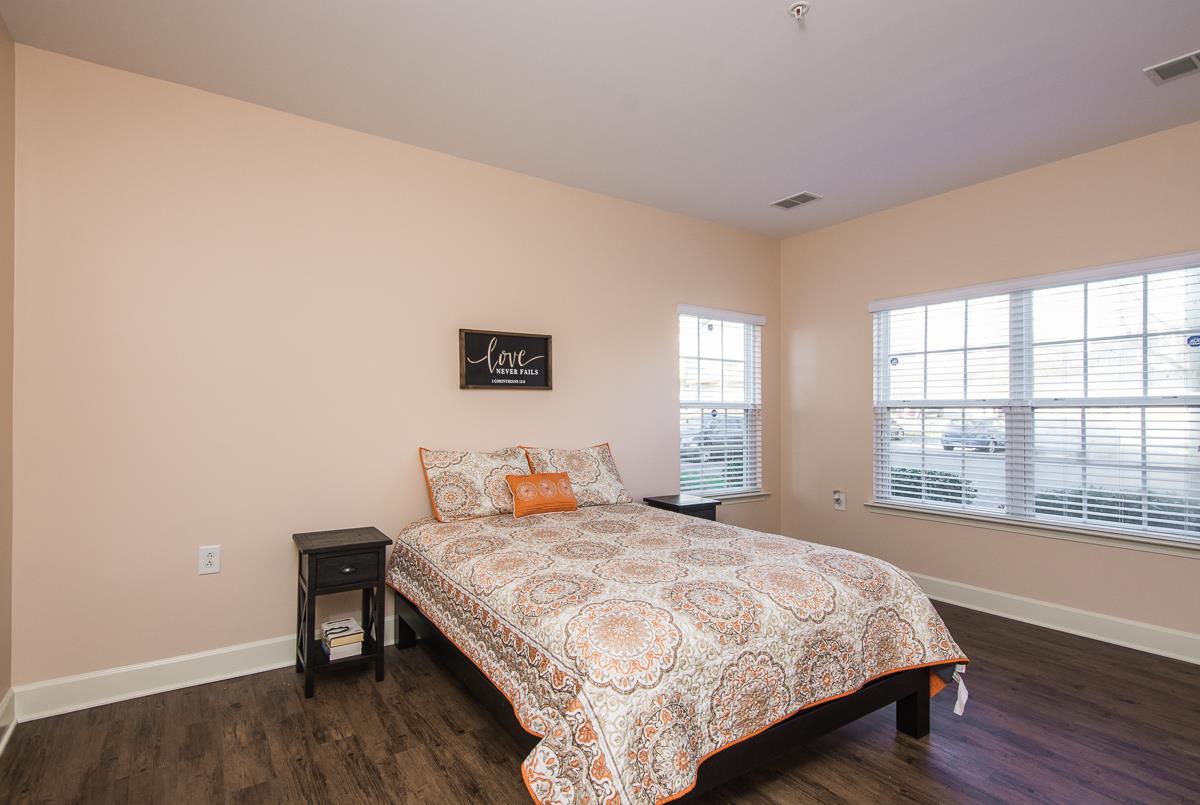 8401 Callabee Way, Unit 4 Nashville, TN 37211 - Photo 12 of 19 a bedroom with a bed and wooden floor