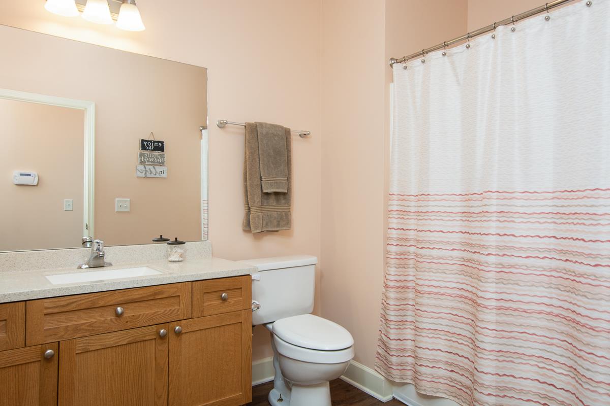 8401 Callabee Way, Unit 4 Nashville, TN 37211 - Photo 14 of 19 a bathroom with a toilet sink and mirror
