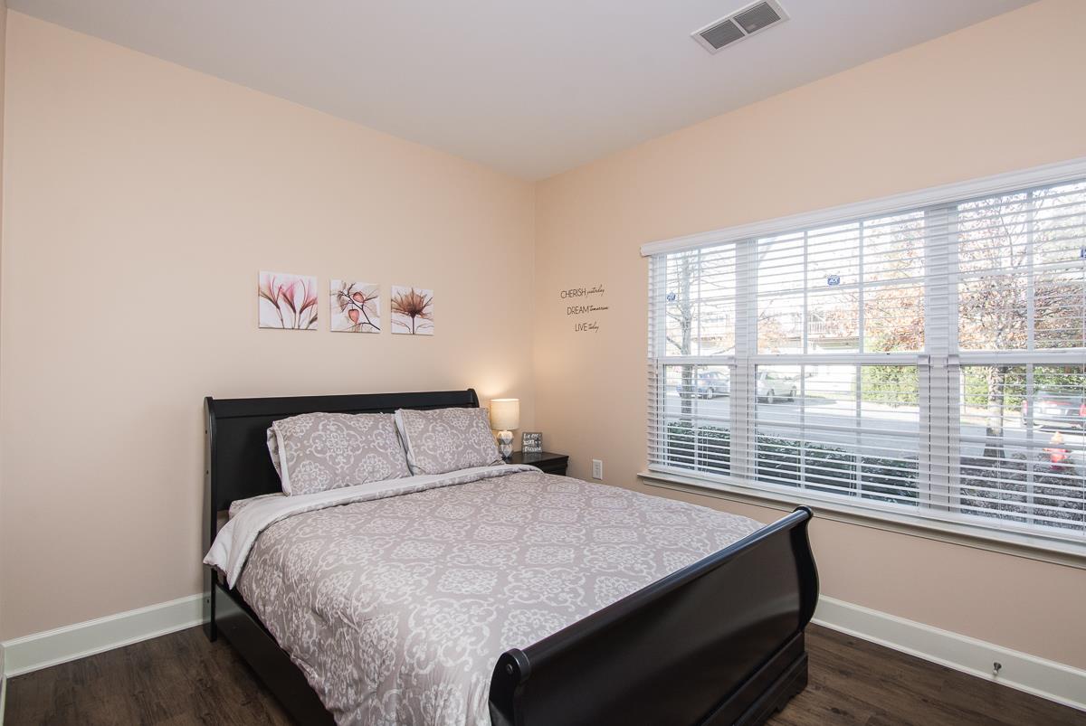 8401 Callabee Way, Unit 4 Nashville, TN 37211 - Photo 15 of 19 a bedroom with a bed and a large window
