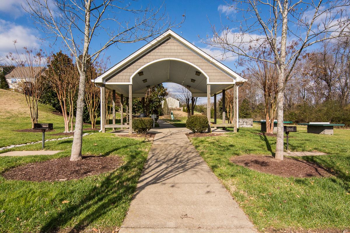 8401 Callabee Way, Unit 4 Nashville, TN 37211 - Photo 16 of 19 a front view of a house with a yard