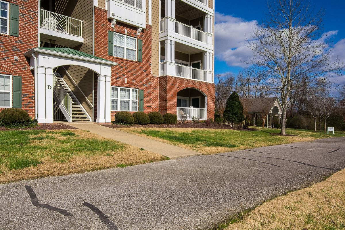 8401 Callabee Way, Unit 4 Nashville, TN 37211 - Photo 17 of 19 a front view of a house with a yard