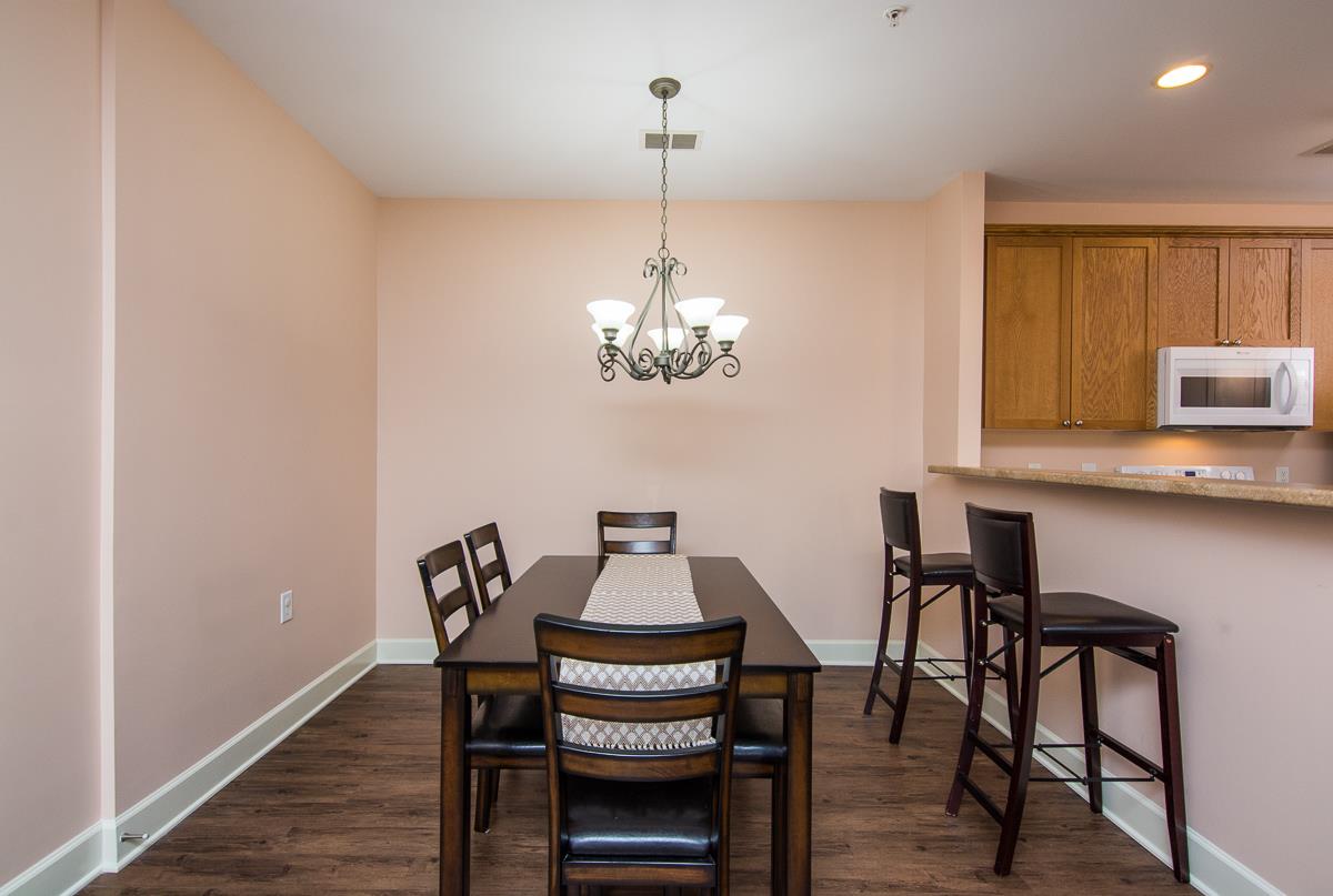 8401 Callabee Way, Unit 4 Nashville, TN 37211 - Photo 6 of 19 a view of a dining room with furniture and wooden floor