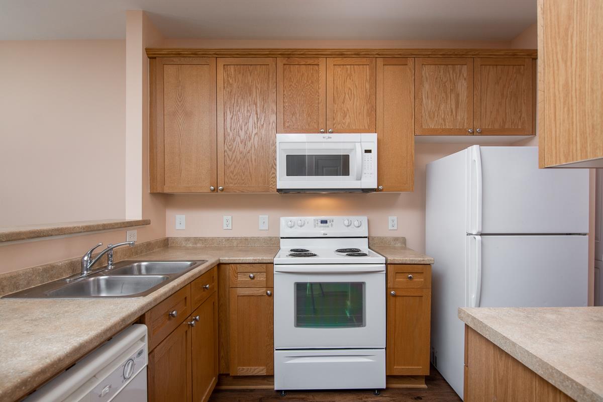 8401 Callabee Way, Unit 4 Nashville, TN 37211 - Photo 7 of 19 a kitchen with a sink a stove a refrigerator and cabinets