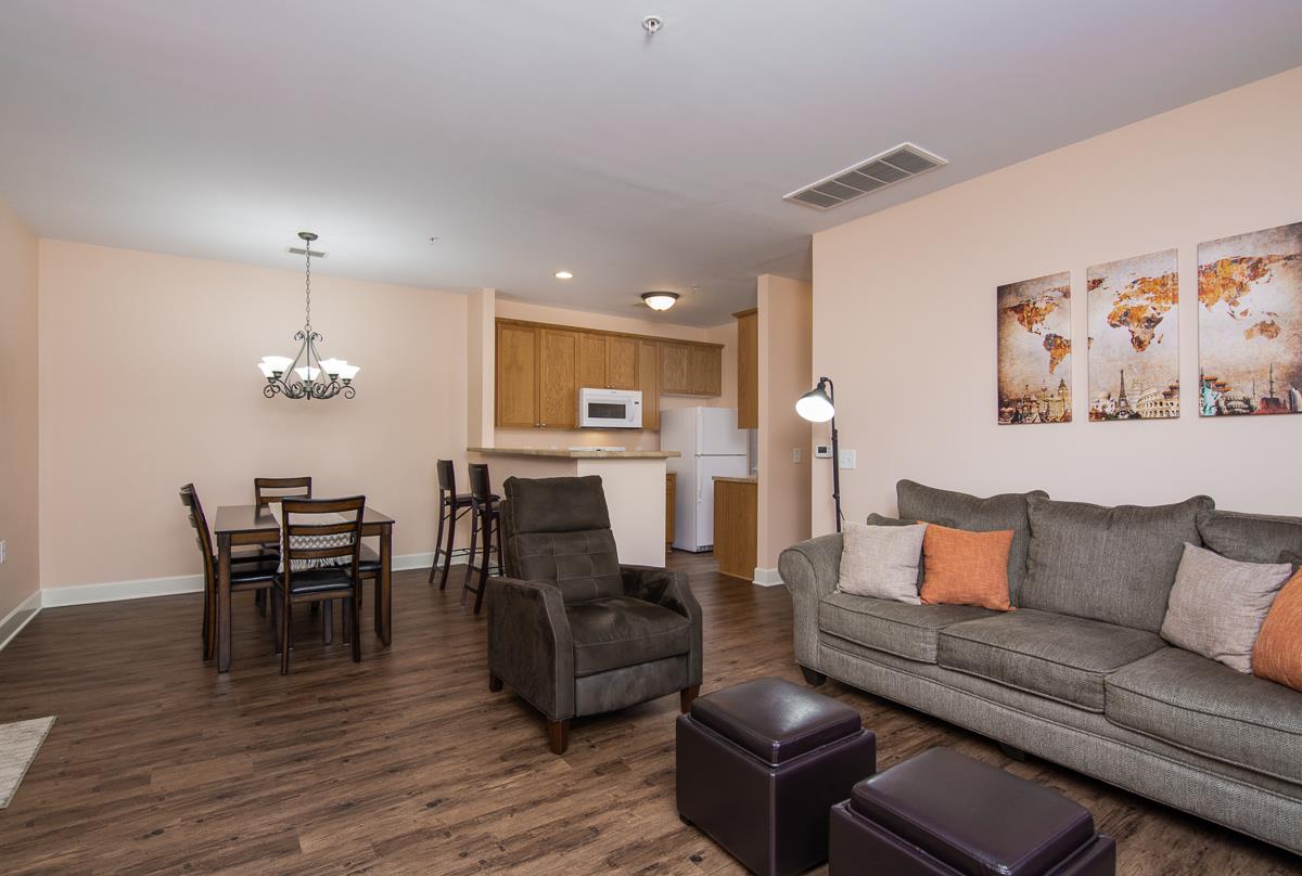 8401 Callabee Way, Unit 4 Nashville, TN 37211 - Photo 9 of 19 a living room with furniture kitchen view and a dining table