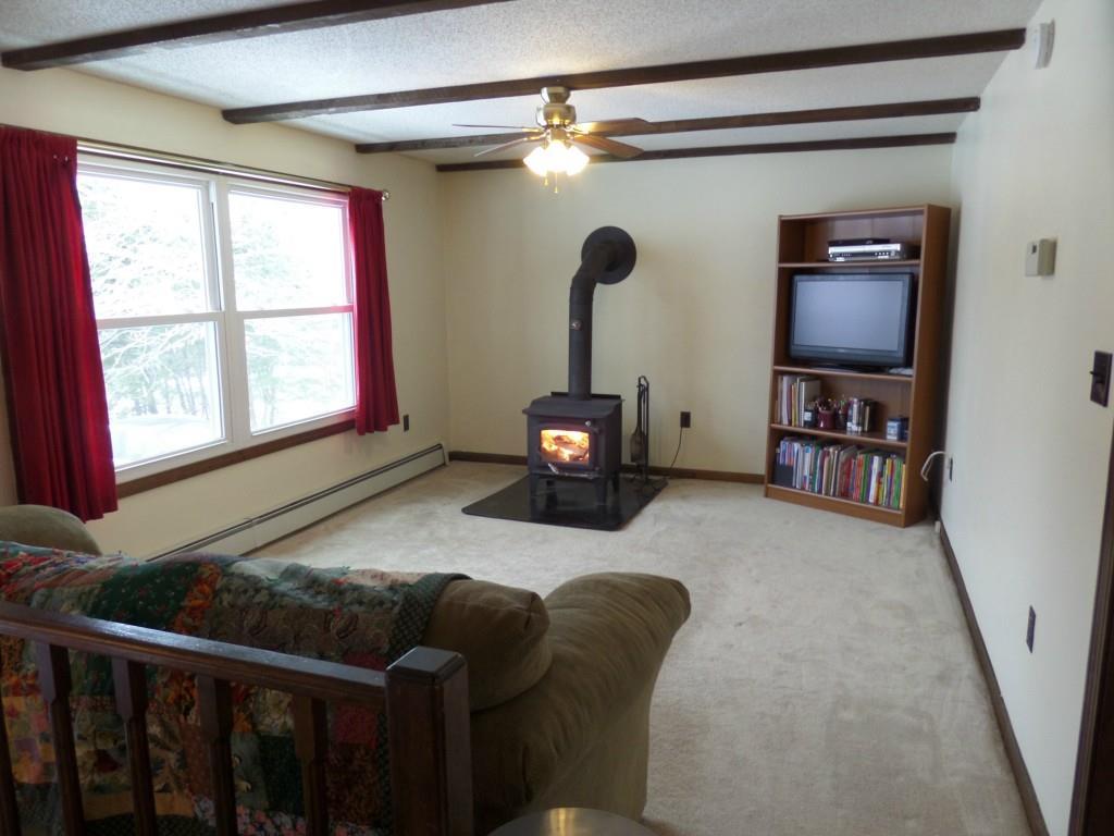 54 Chapman Road Harrison, ME 04040 - Photo 14 of 33 LIVING ROOM WITH VERY EFF. WOODSTOVE