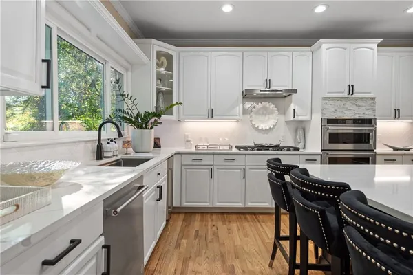 a view of a house with wooden deck