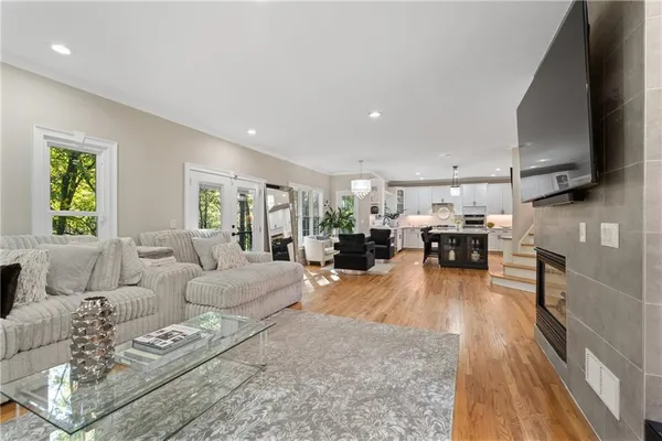 a spacious bedroom with a bed and a television