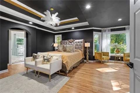 a bathroom with a toilet a sink and glass door