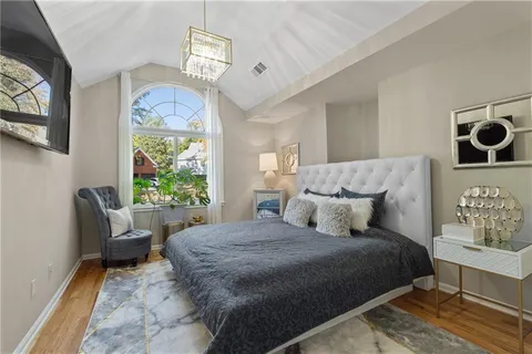 a living room with furniture fireplace and wooden floor