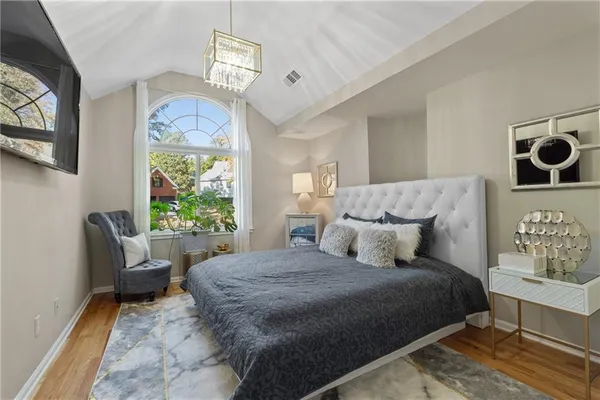 a living room with furniture fireplace and wooden floor