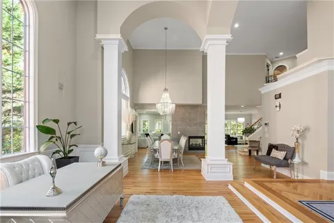 a view of a dining room with furniture window and wooden floor